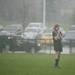 A Huron senior Maggie Hannaford waits for the start of the second half of the game against Dexter as the rain pours down on Tuesday, April 23. Daniel Brenner I AnnArbor.com